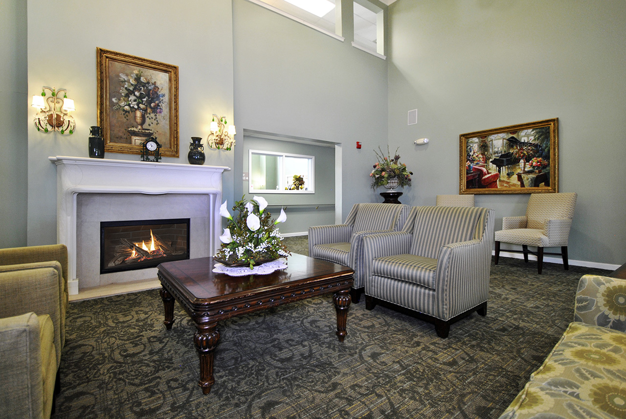 Lounge seating with fireplace at Oakhaven Manor