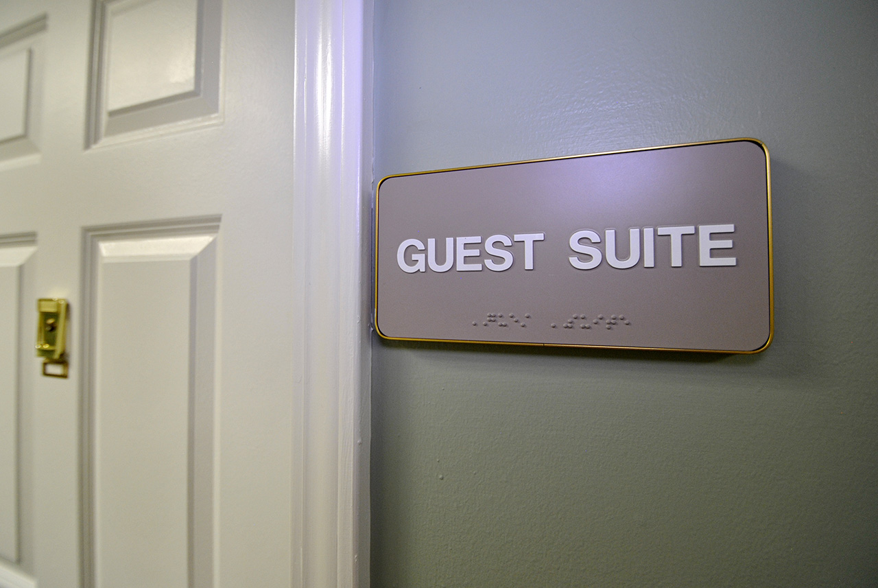 Sign outside guest suite door at Oakhaven Manor